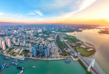 A beautiful beach in Haikou with clear blue water and white